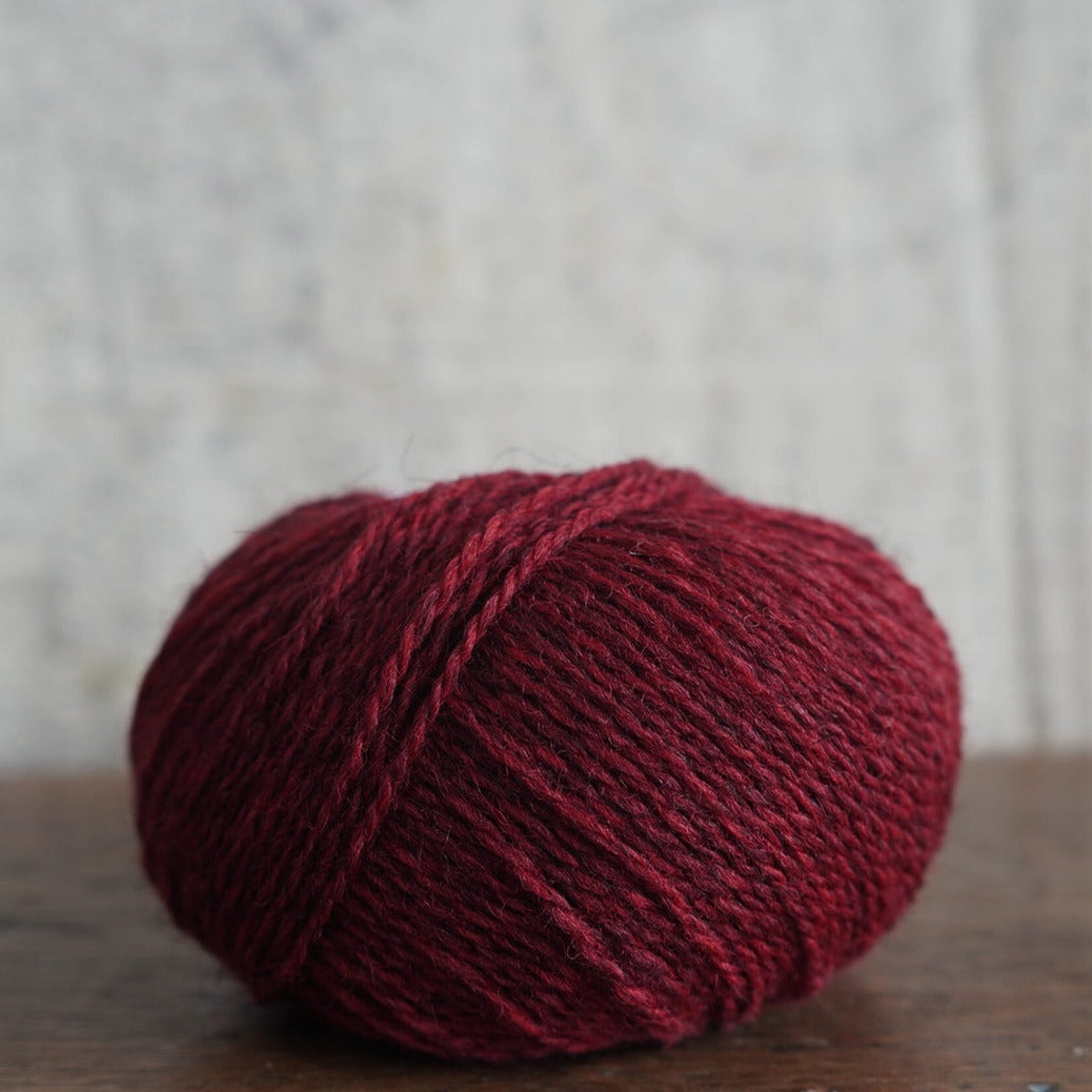Knitting wool in shade field poppy from the outer Hebrides