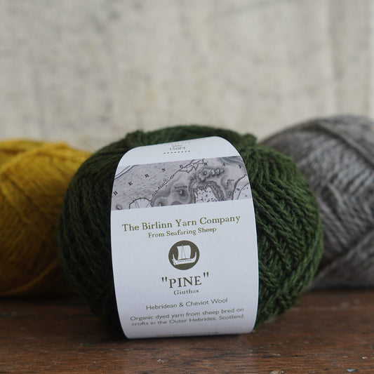 Pine yarn is 100% wool in dark forest green.
