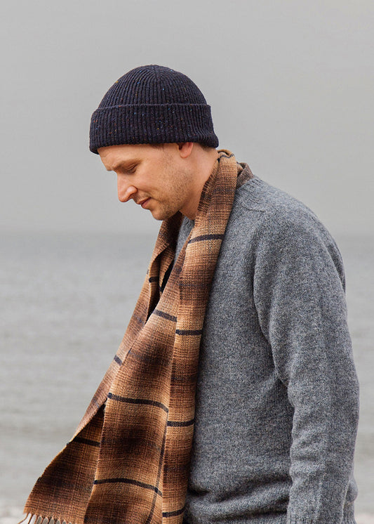 Scottish scarf woven in earthy brown hues with a dark blue overcheck. Scottish Textiles Showcase.