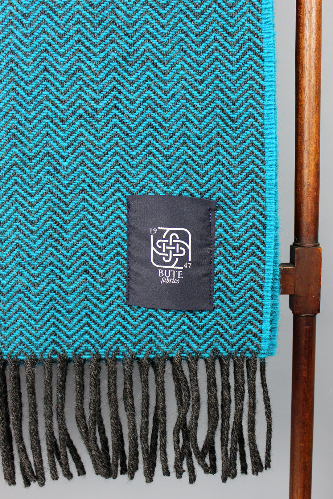 Wool chevron throw in petrol blue colourway.