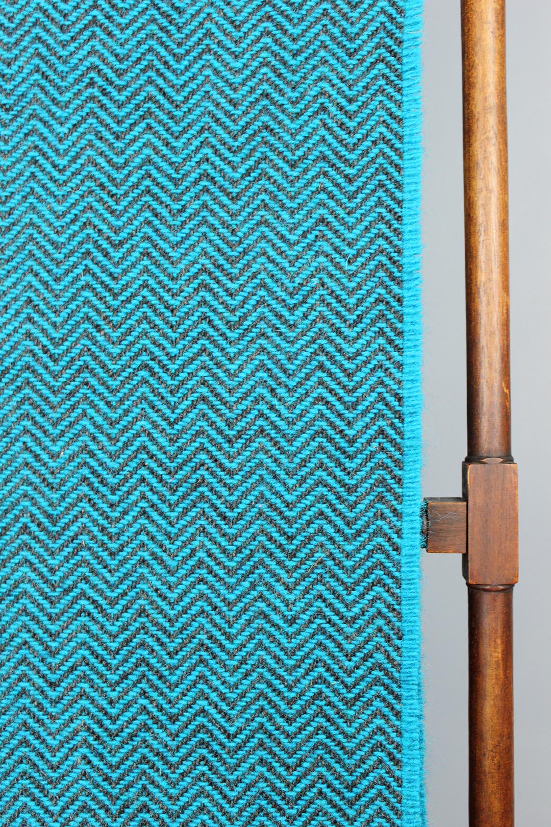 Wool chevron throw in petrol blue colourway.