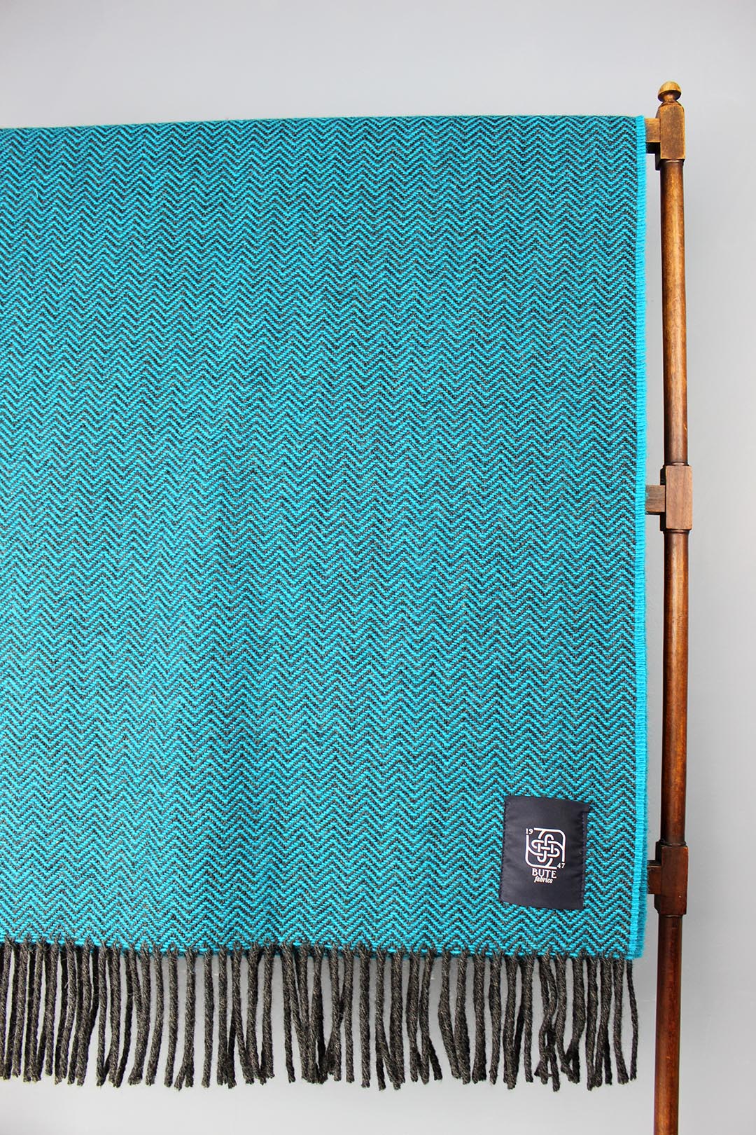 Wool chevron throw in petrol blue colourway.