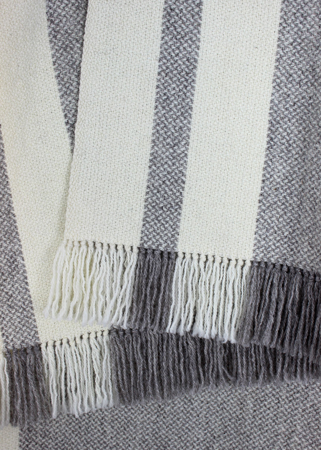 Handwoven Falkland blanket detail of hand-tied tassles.