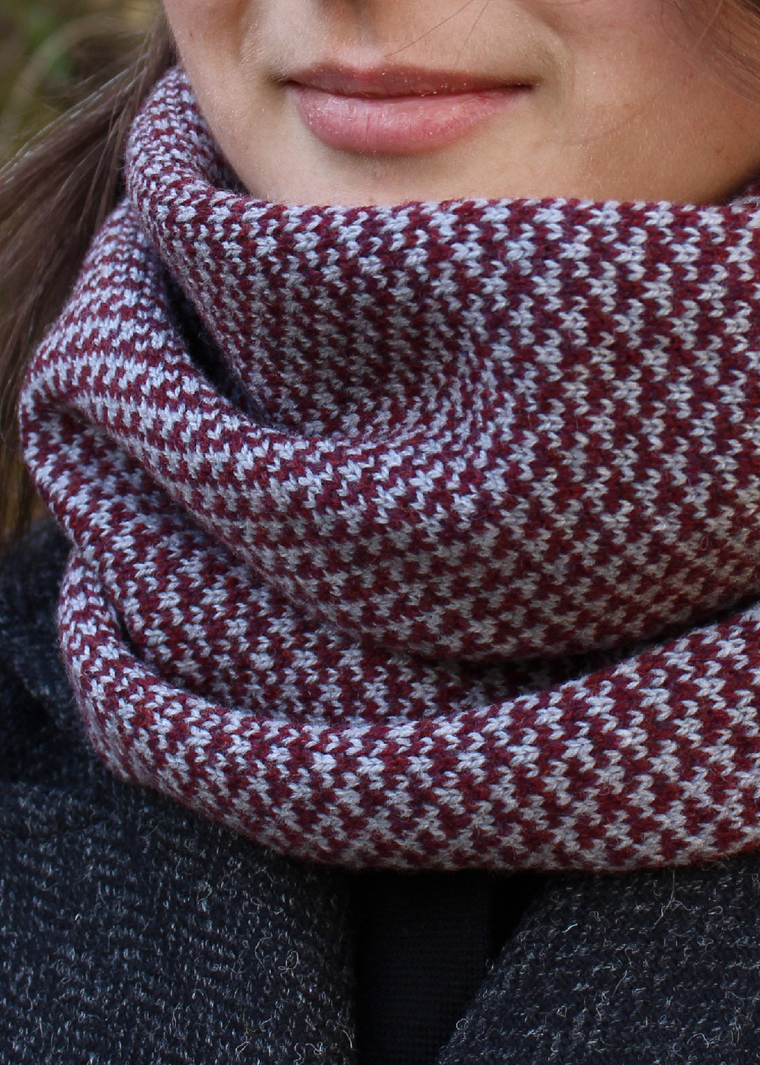 Merino lambswool neck warmer in burgundy and pale grey with a design inspired by the Hebridean sea on the crossing to the Isle of Harris.