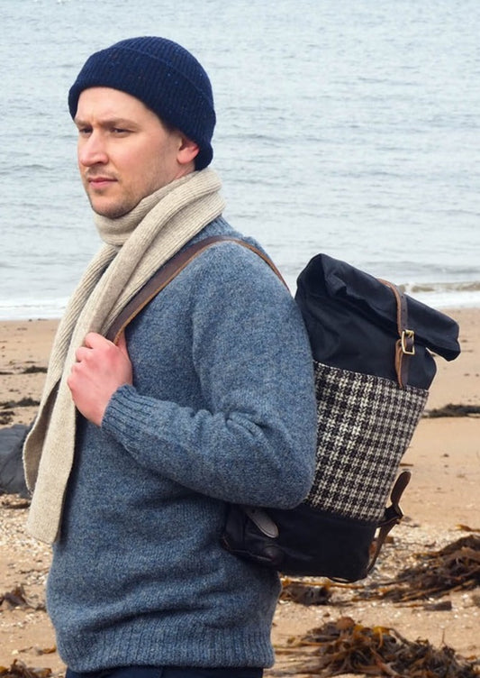 Harris Tweed in brown and white small check and Waxed Cotton Canvas backpack with black leather trim. Made in Scotland