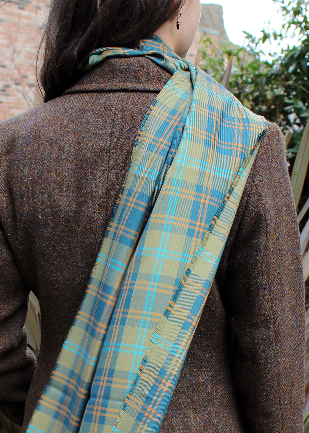 The traditional Douglas tartan has been given a makeover in this luxurious silk scarf by ANTA.&nbsp;