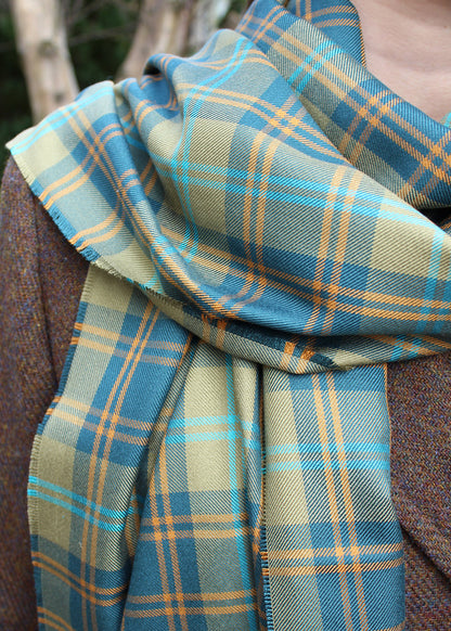 The traditional Douglas tartan has been given a makeover in this luxurious silk scarf by ANTA.