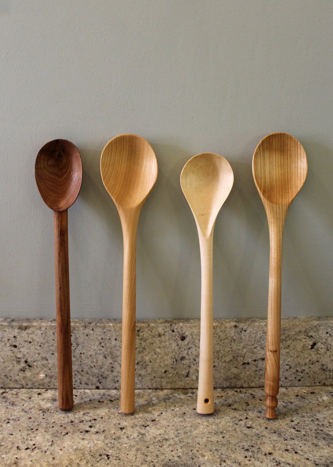 Big stirrer spoons, hand carved in Fife. Scottish textiles showcase.