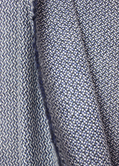 Pure cashmere throw woven in a subtle honeycomb pattern in a blend of blue tones.
