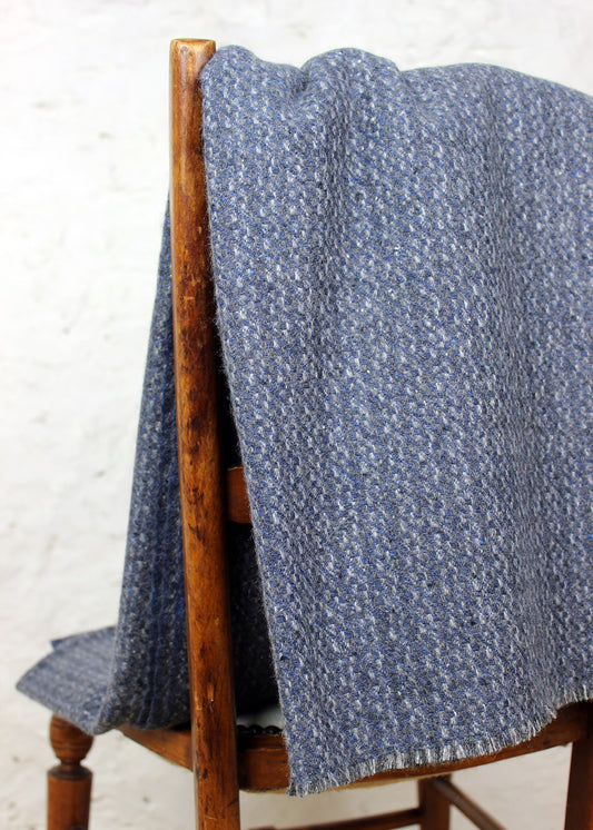 Pure cashmere throw in a subtle mottled slate blue-grey.