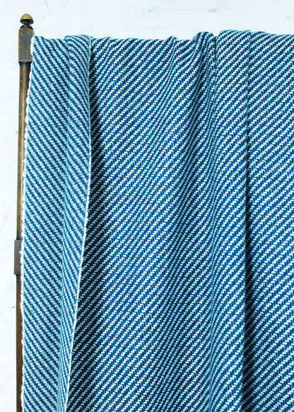 Pure cashmere throw in a contemporary teal and white diagonal stripe.