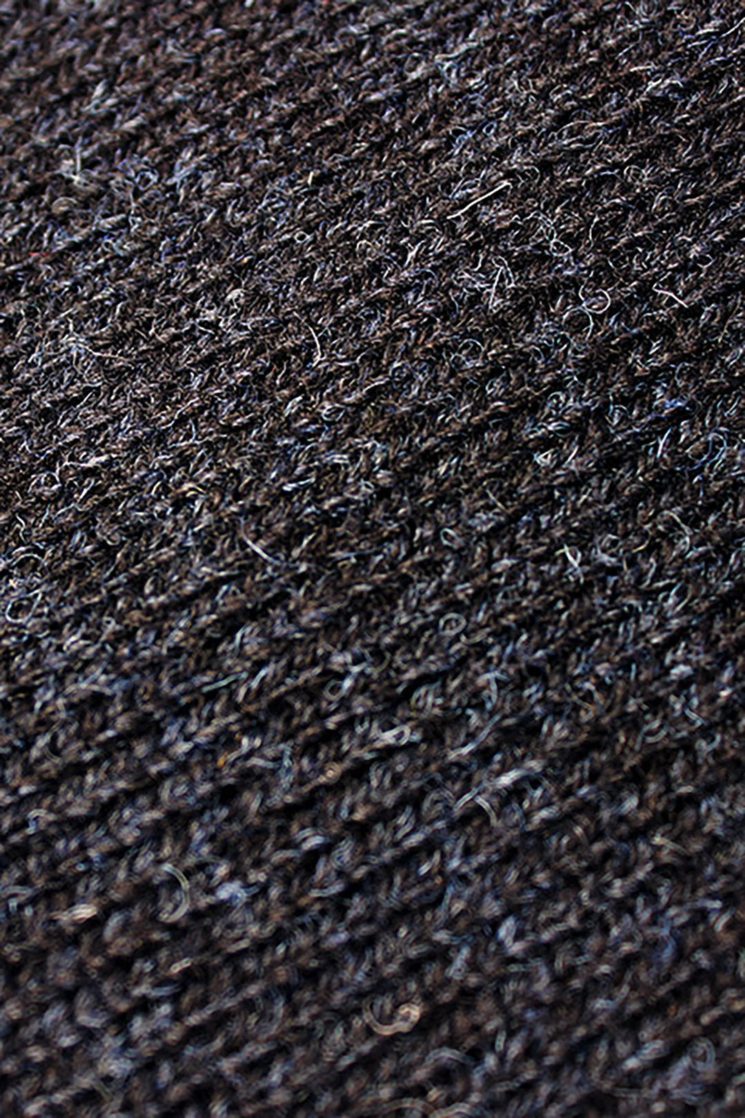 Made from authentic Shetland sheep wool from Jamieson's of Shetland, this beautifully knitted crew neck jumper comes in a black navy marl, giving it a beautiful textured feel. Exclusive to the Scottish Textiles Showcase.