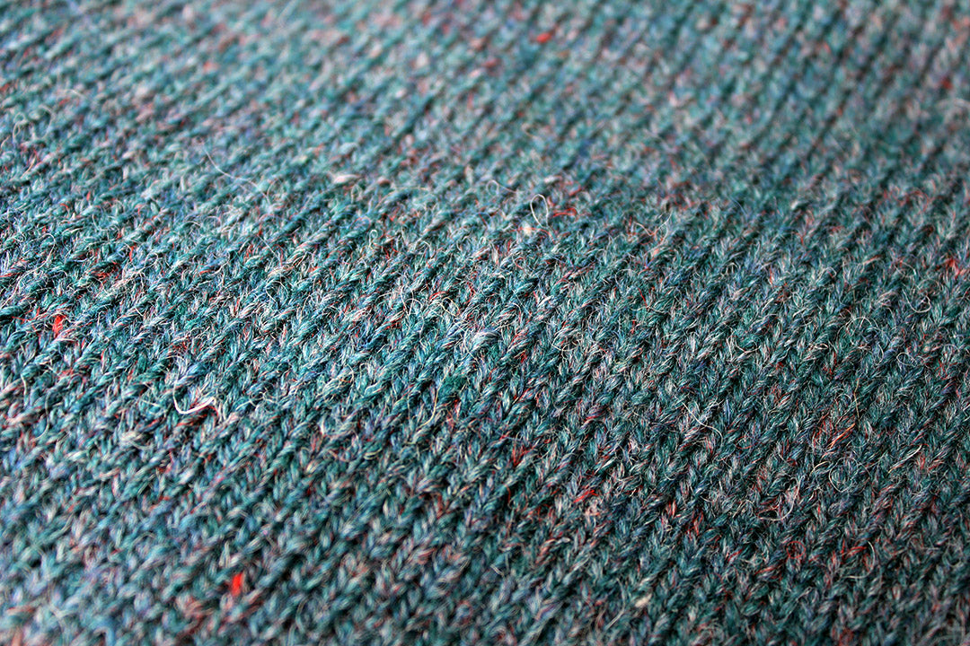 Made from authentic Shetland sheep wool from Jamieson's of Shetland, this beautifully knitted crew neck jumper comes in an ocean turquoise with subtle warm tones when looked at closely. Exclusive to the Scottish Textiles Showcase.