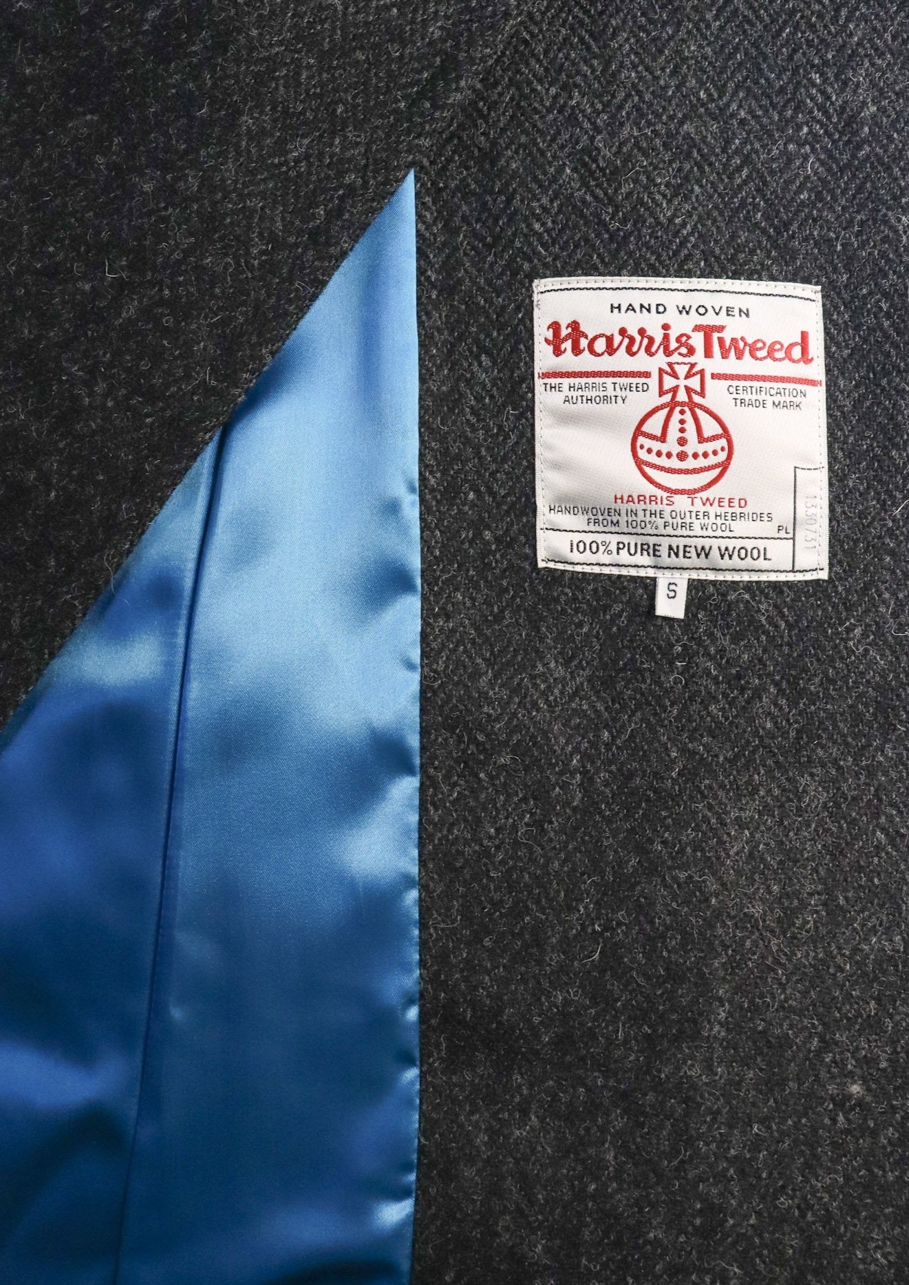 Edith coat in black herringbone Harris Tweed, with blue satin lining, Elizabeth Martin