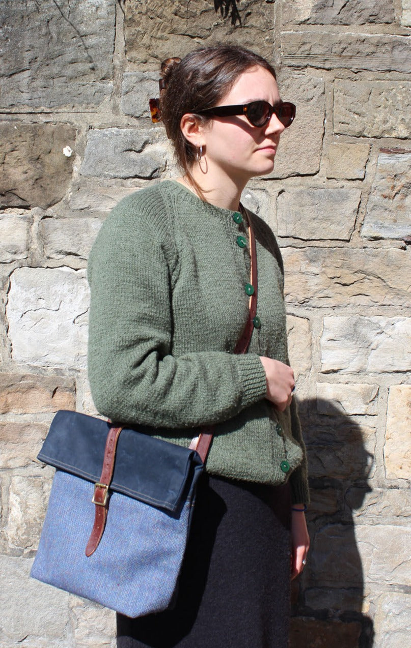 Cairn roll-top bags are a great combination of two Scottish cloths, waxed cotton canvas and Harris Tweed, finished with oak tanned leather.