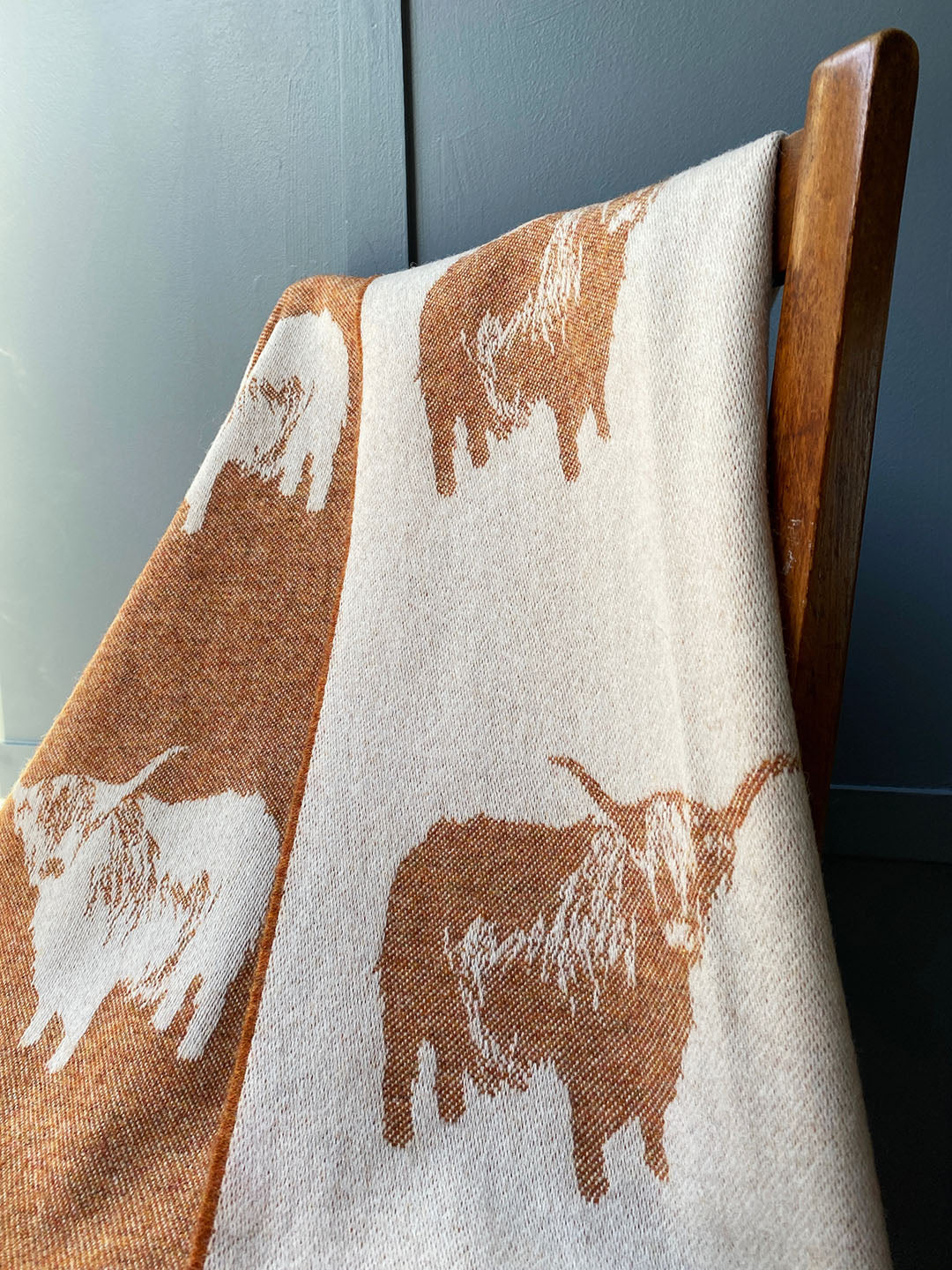Highland cow pure wool throw with image of highland cow reversible colourway rust and cream