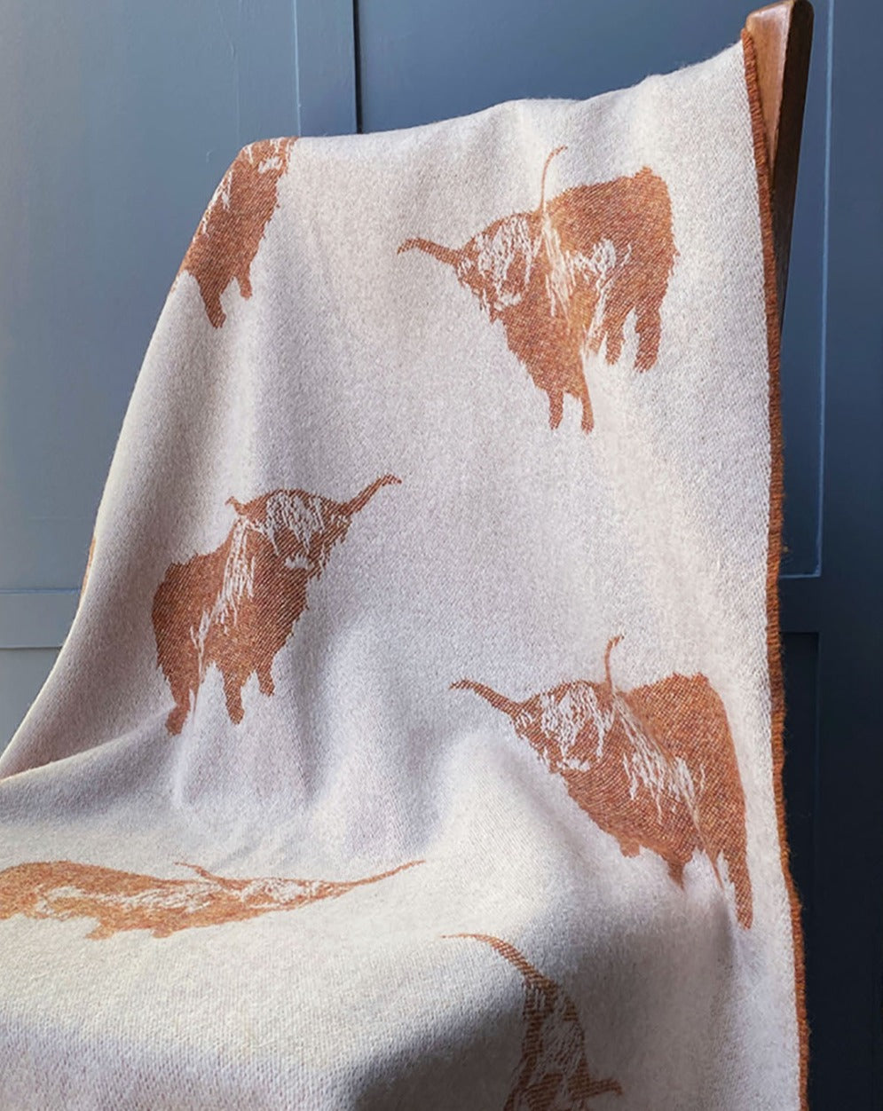 Highland cow pure wool throw with image of highland cow reversible colourway rust and cream