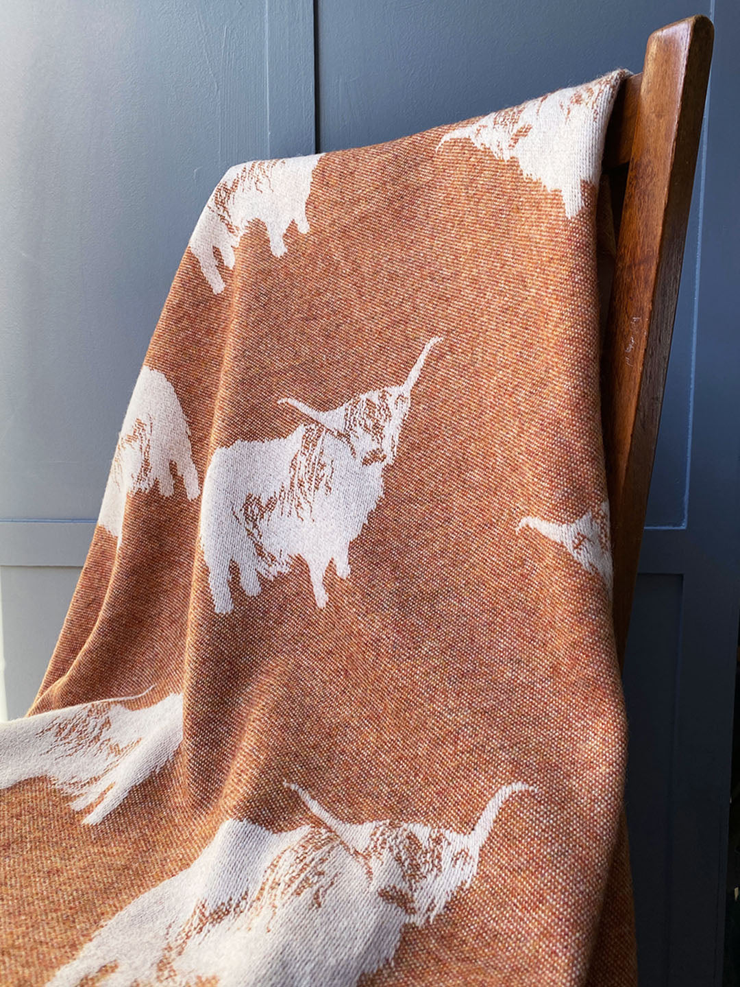 Highland cow pure wool throw with image of highland cow reversible colourway rust and cream