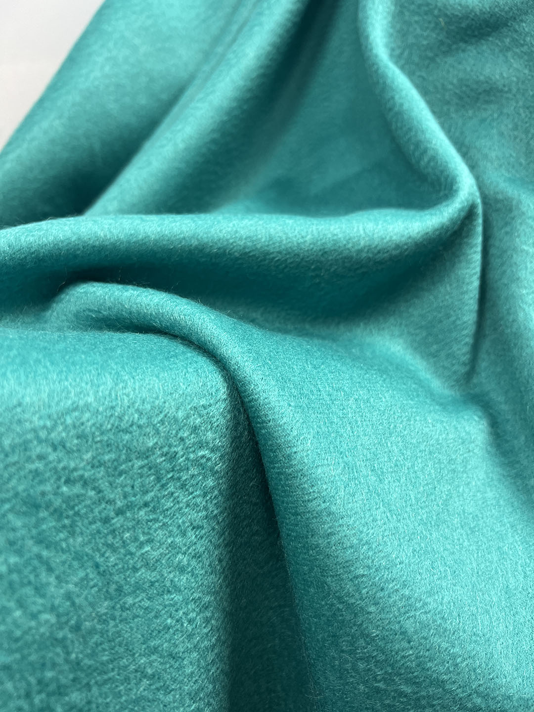 Vibrant turquoise luxury cashmere throw.