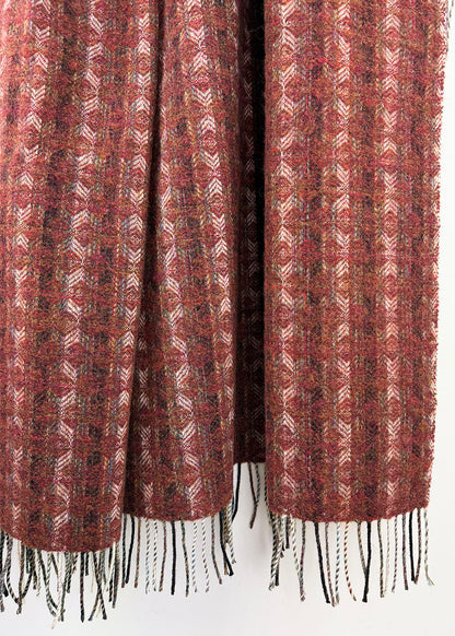Pure wool tapestry throw in hues of red.