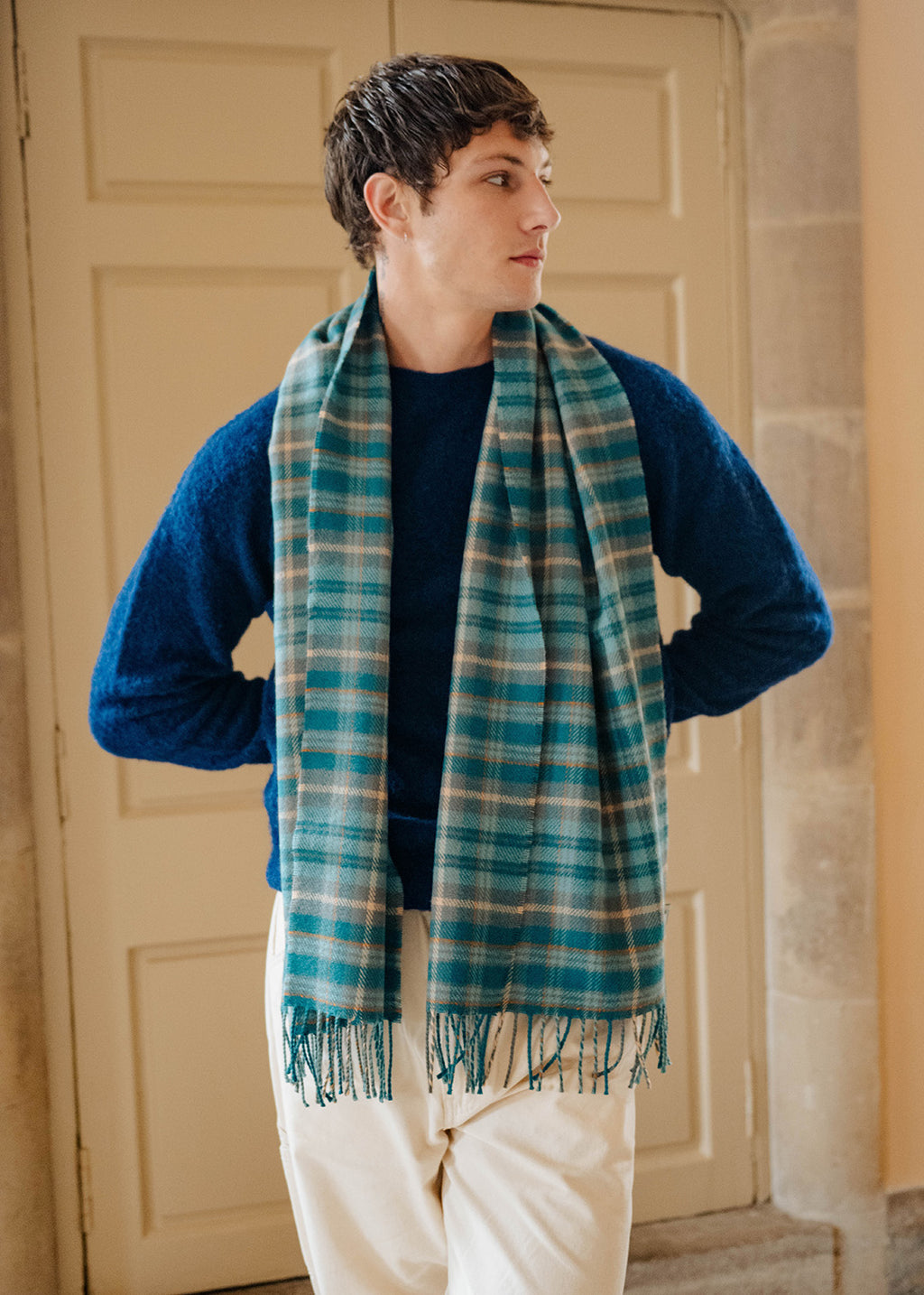 Lambswool teal tartan shawl on model.