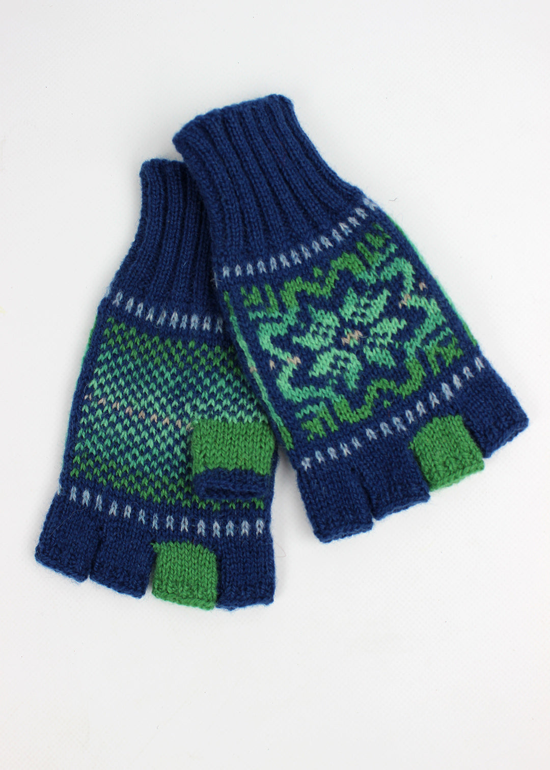 Hand knitted Fair Isle fingerless gloves in blue with emerald green details, made exclusively for the Scottish Textiles Showcase.