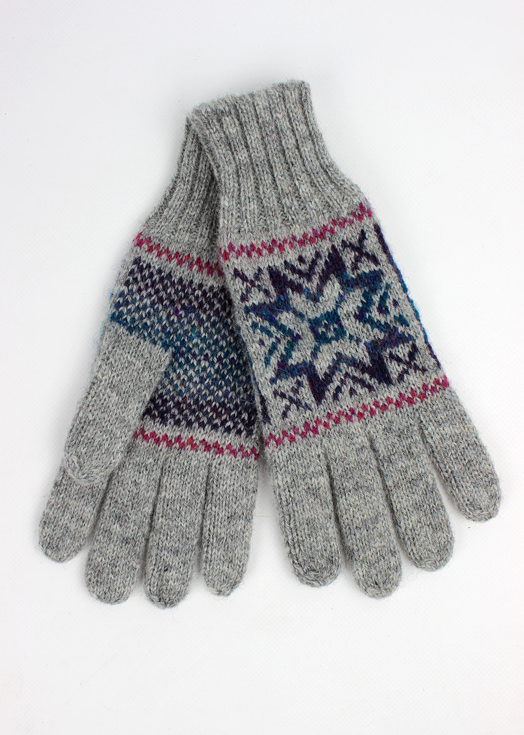 Hand knitted Fair Isle gloves in grey with colourful details, made exclusively for the Scottish Textiles Showcase.