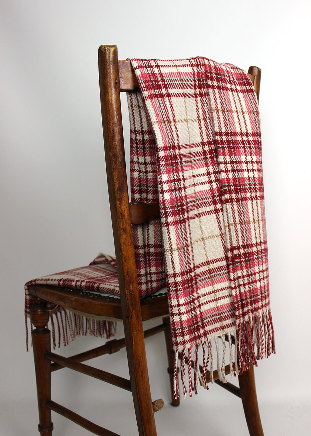 Merino wool baby blanket in red and coral check.