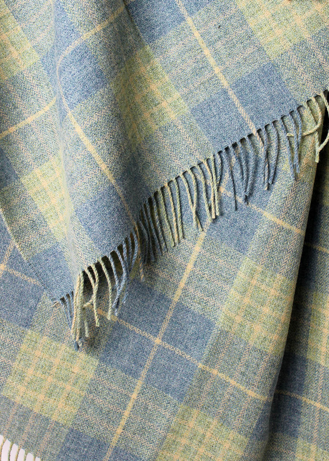 Scottish lambswool throw woven in pale blue and green Robert Carver colourway.