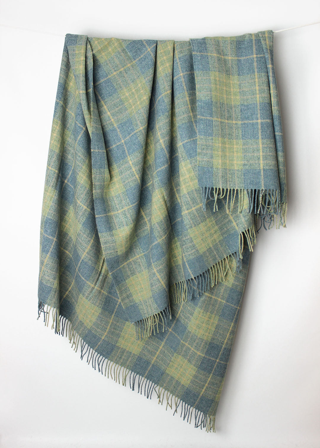 Scottish lambswool throw woven in pale blue and green Robert Carver colourway.
