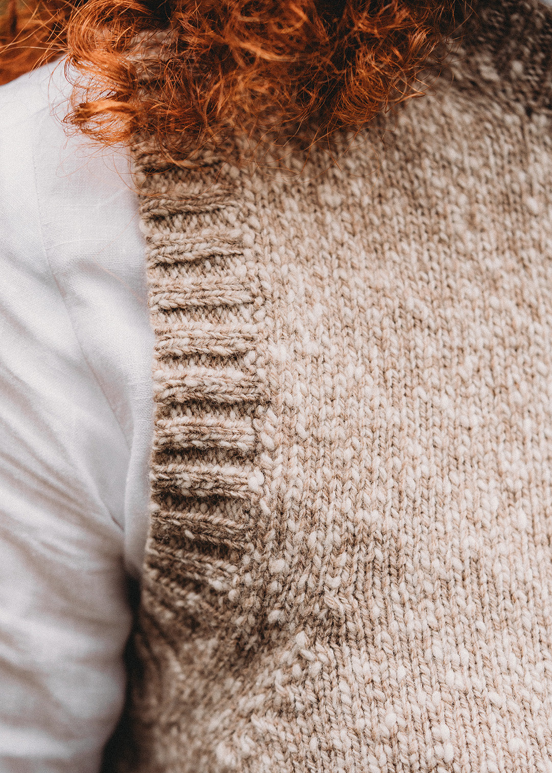 Fawn and white marl vest knitted in the softest lambswool.