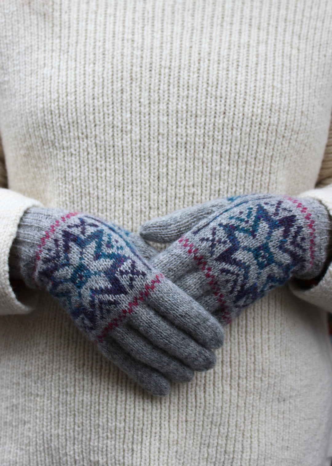 Pair of grey Fair Isle knitted gloves.