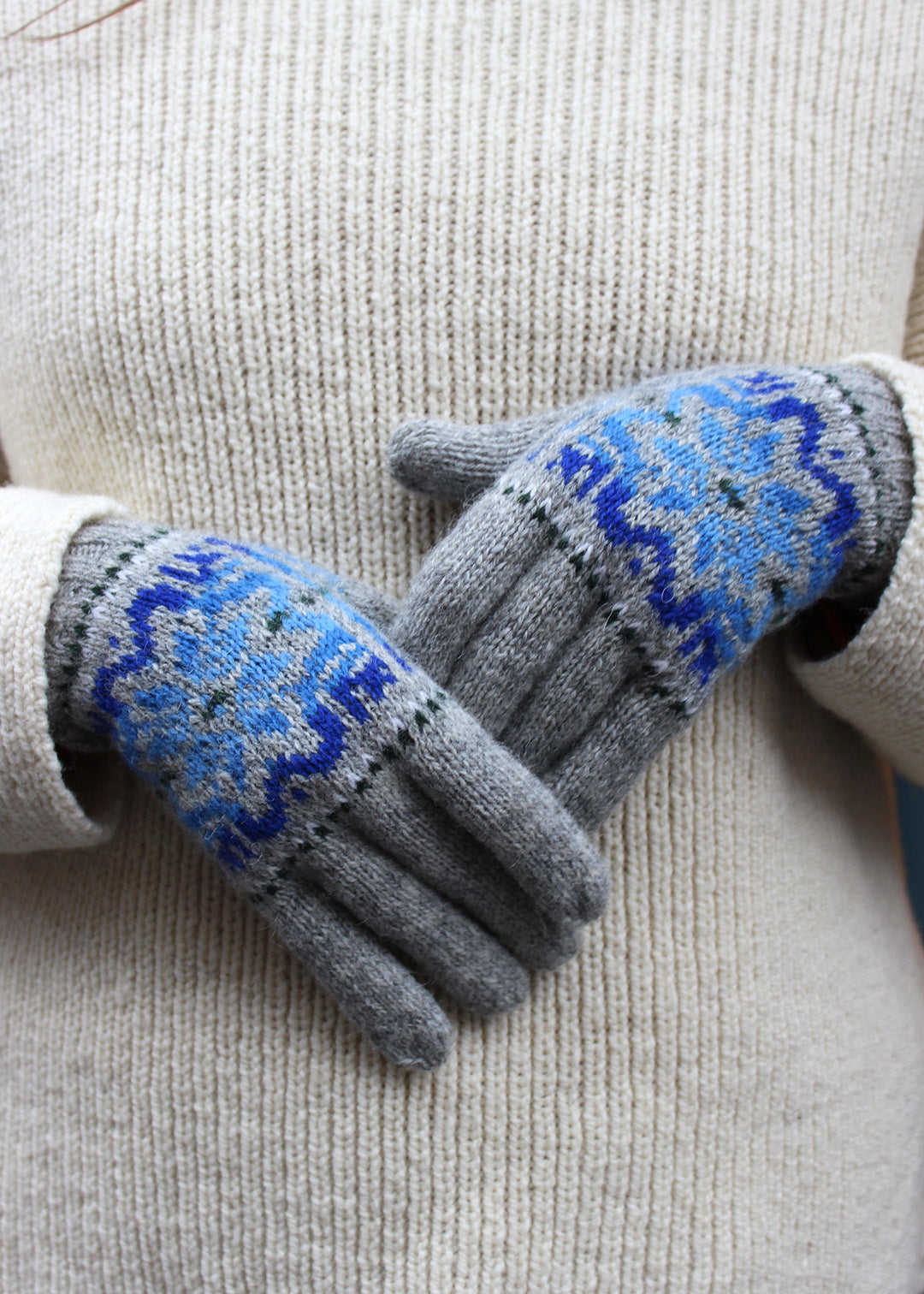 Pair of grey Fair Isle knitted gloves.