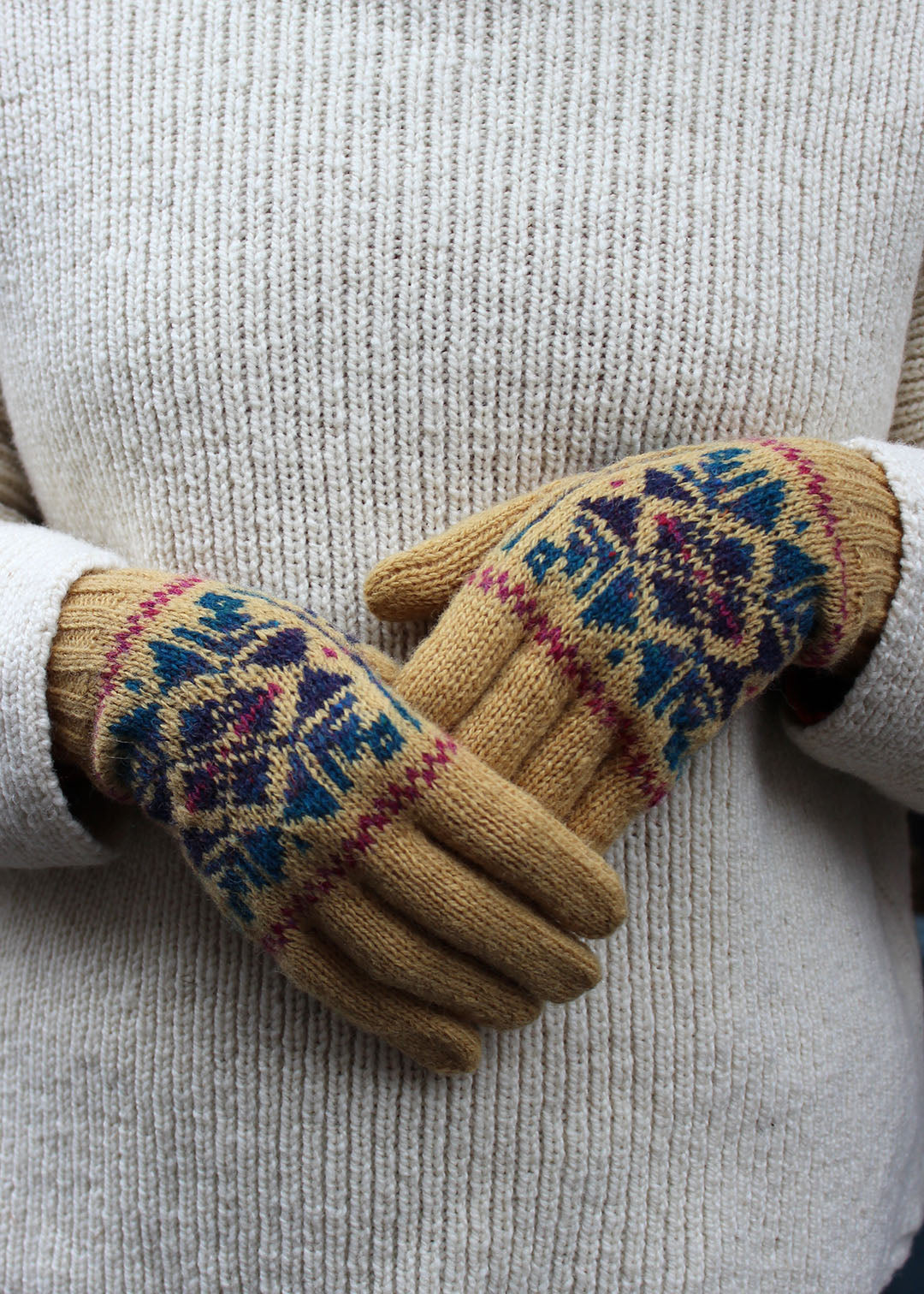 Pair of ochre Fair Isle knitted gloves.