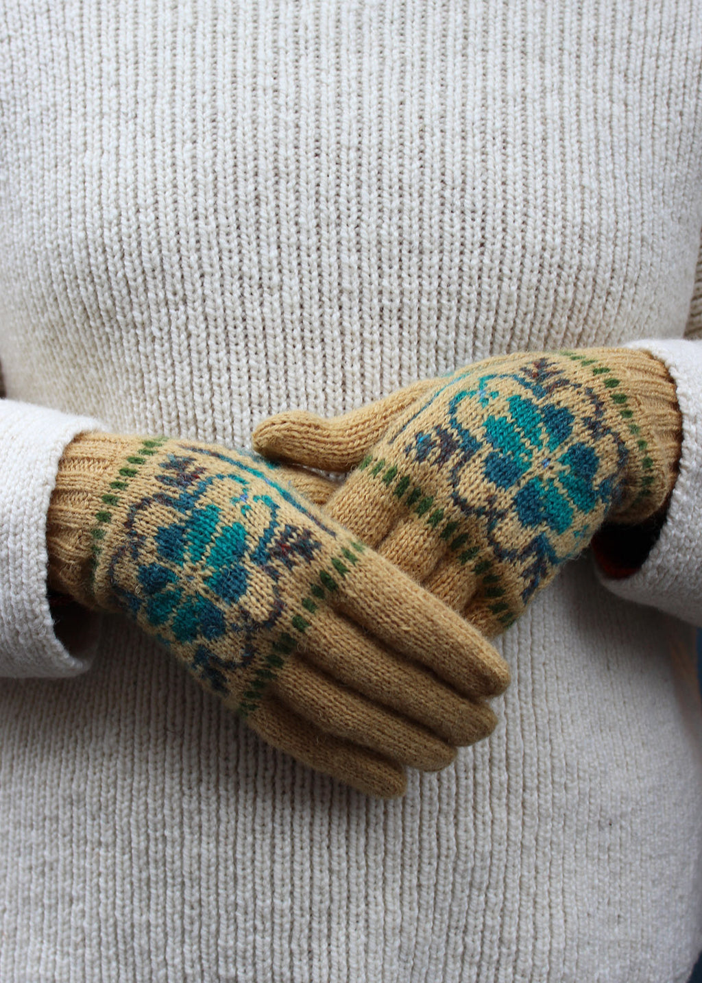 Pair of ochre Fair Isle knitted gloves.