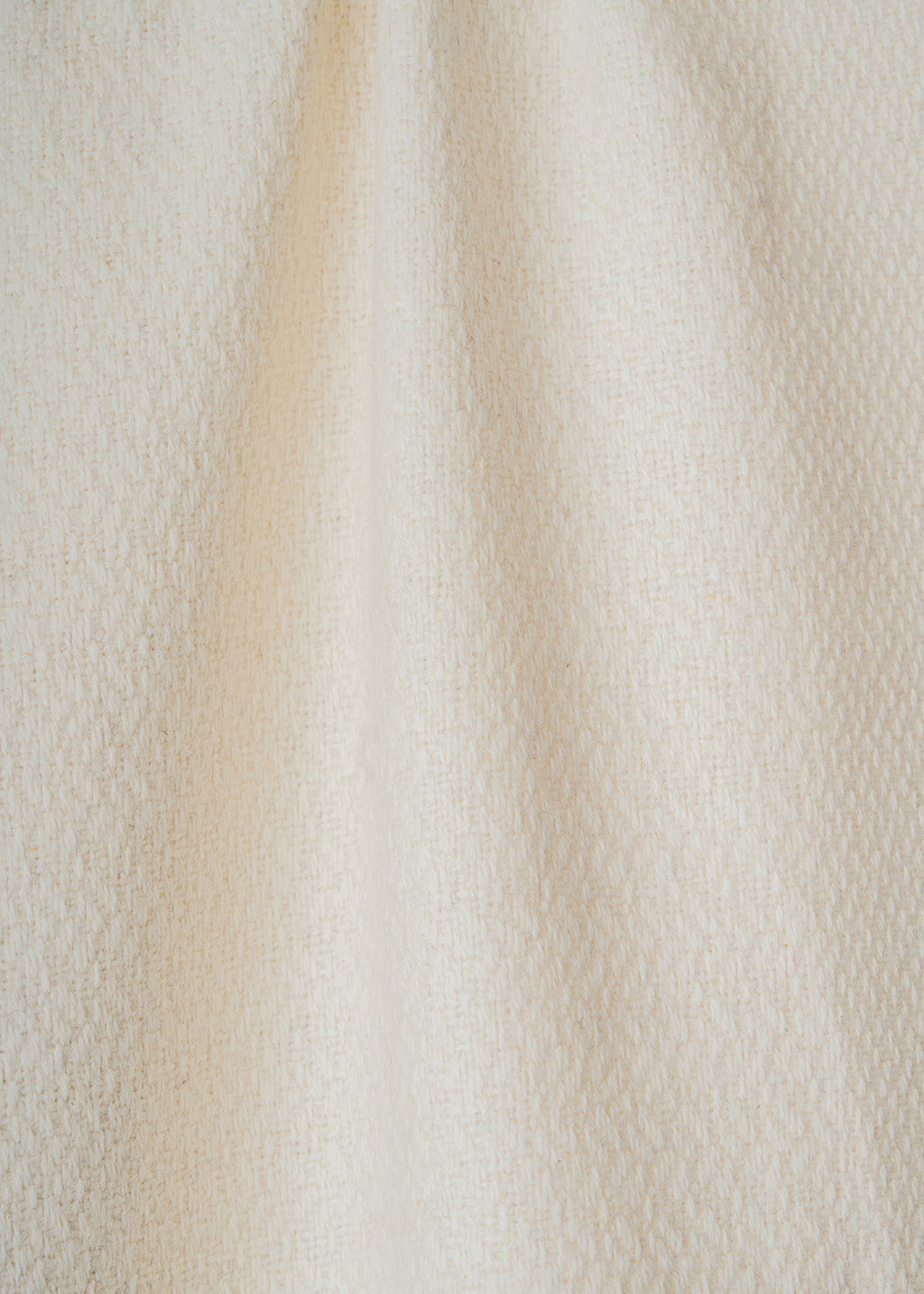 White alpaca scarf detail.