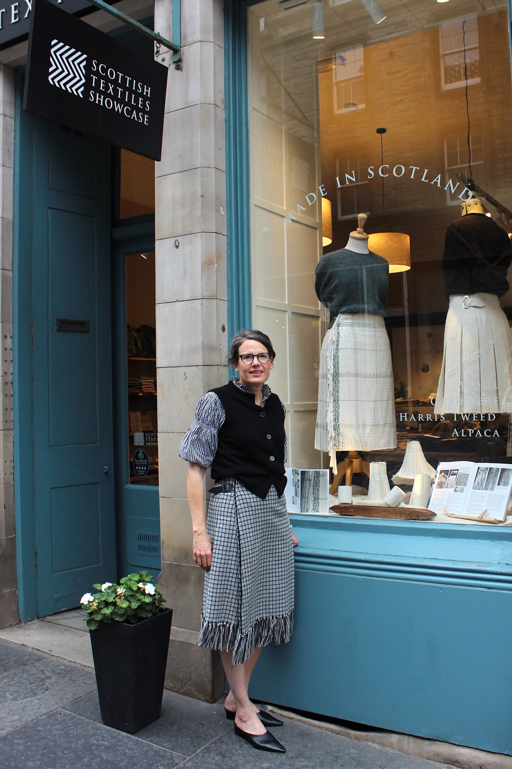 Andrea Chappell kiltmaker outside Scottish Textiles Showcase