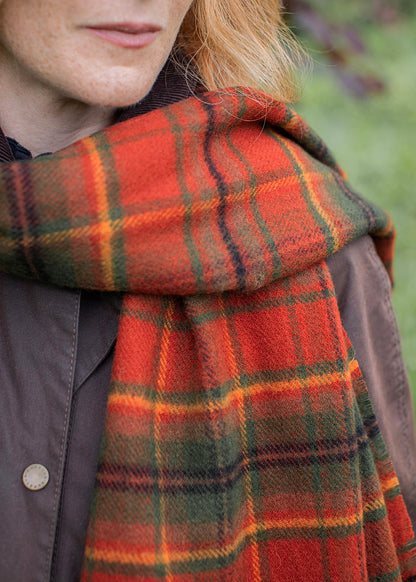 Autumn Woodland Walk tartan shawl close up on female model