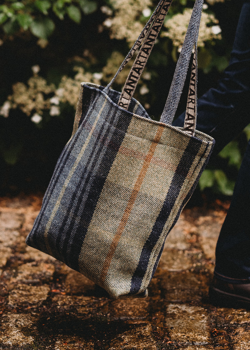 The iconic ANTA Carpet Bag in a sage and dark blue check.
