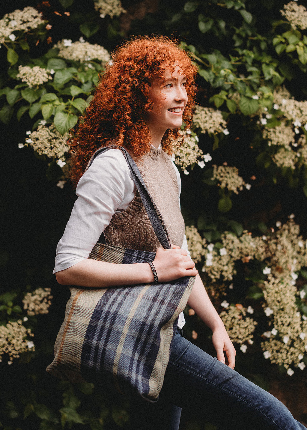 The iconic ANTA Carpet Bag in a sage and dark blue check.
