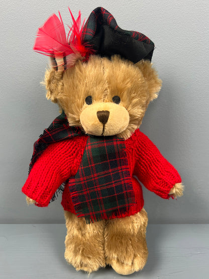 Teddy bear wearing red knitted jumper with a tartan scarf in the MacDonald Modern clan tartan