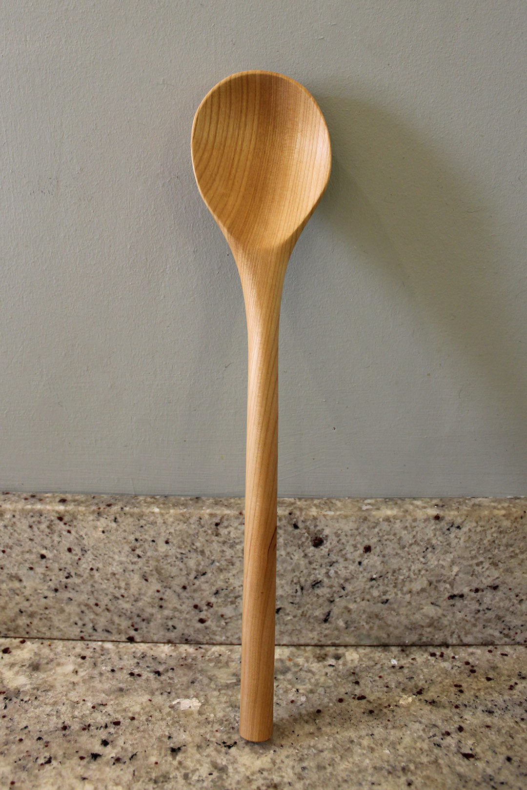 Big stirrer cooking spoon hand carved from Cherry, in Fife. Scottish Textiles Showcase.