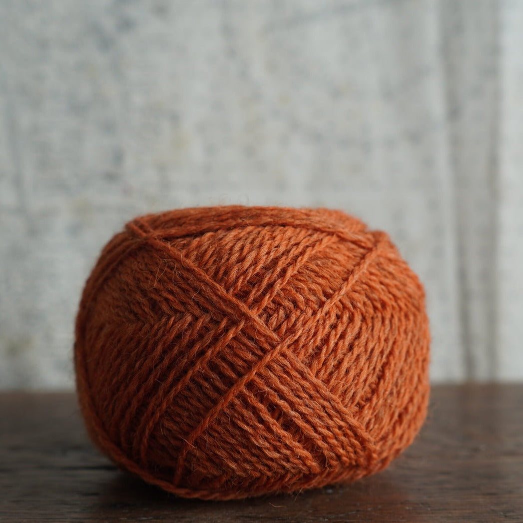 Lambswool yarn in shade periwinkle orange, from the outer Hebrides