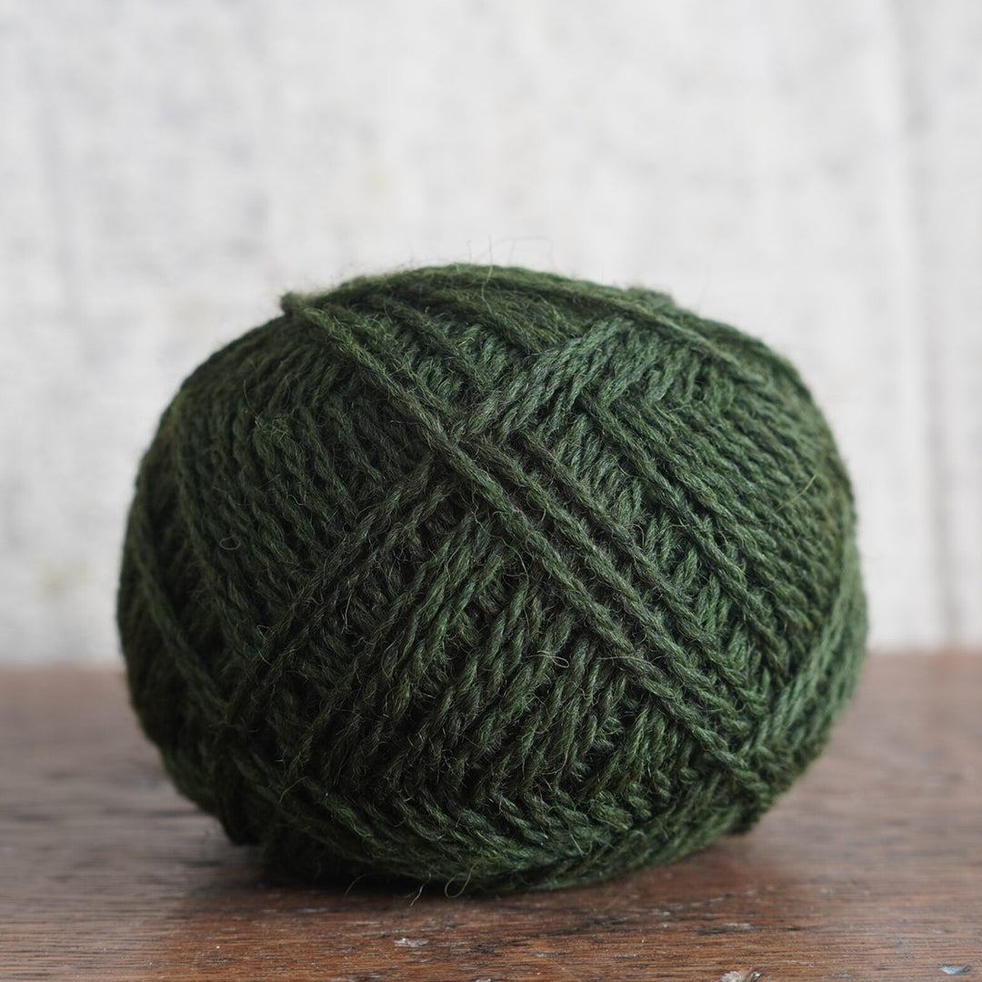 Pine yarn is 100% wool in dark forest green.