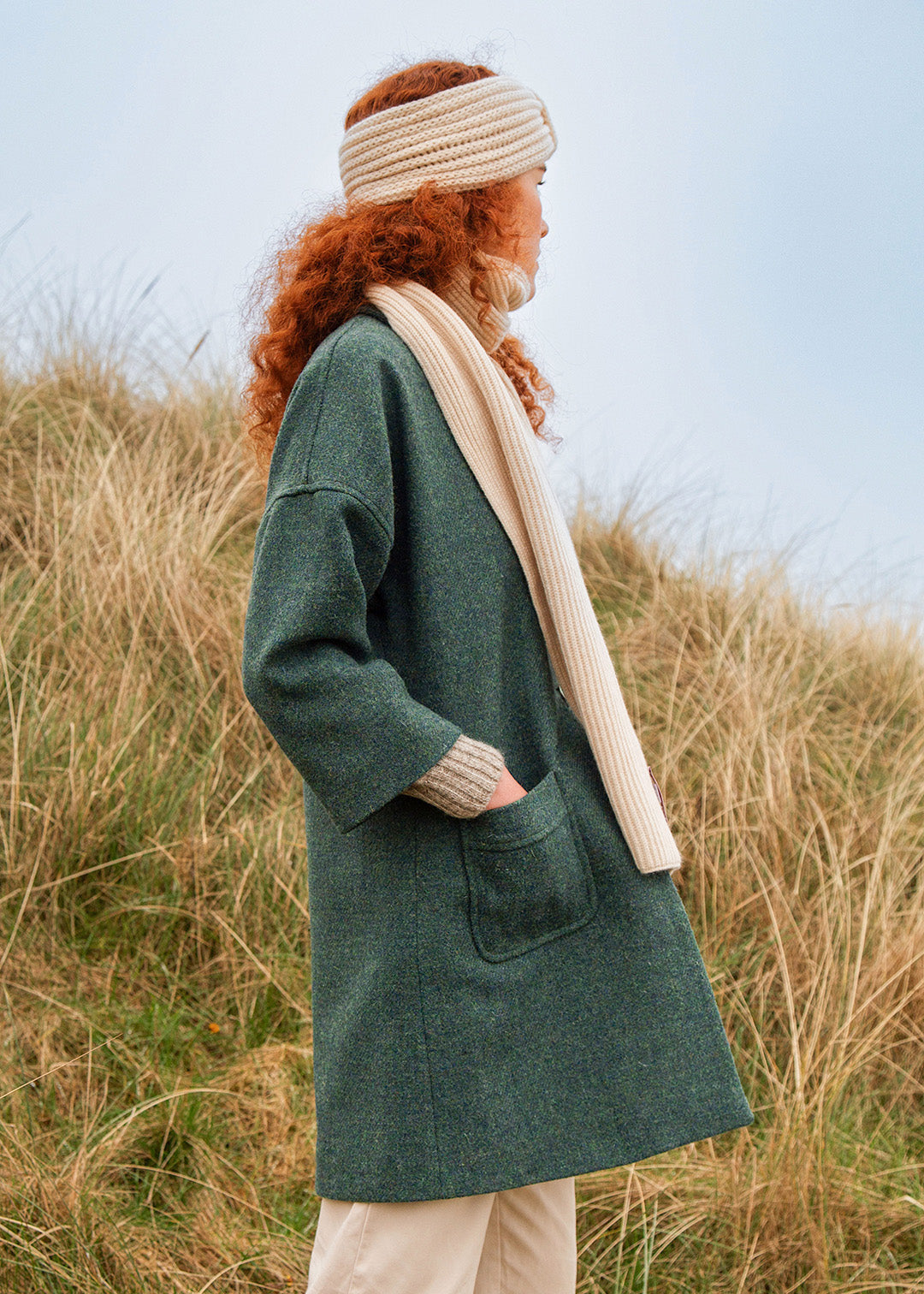 The classic Fiona coat in sea blue is made from hand woven Harris Tweed and features a full satin blue lining. Shown on model. Scottish Textiles Showcase.