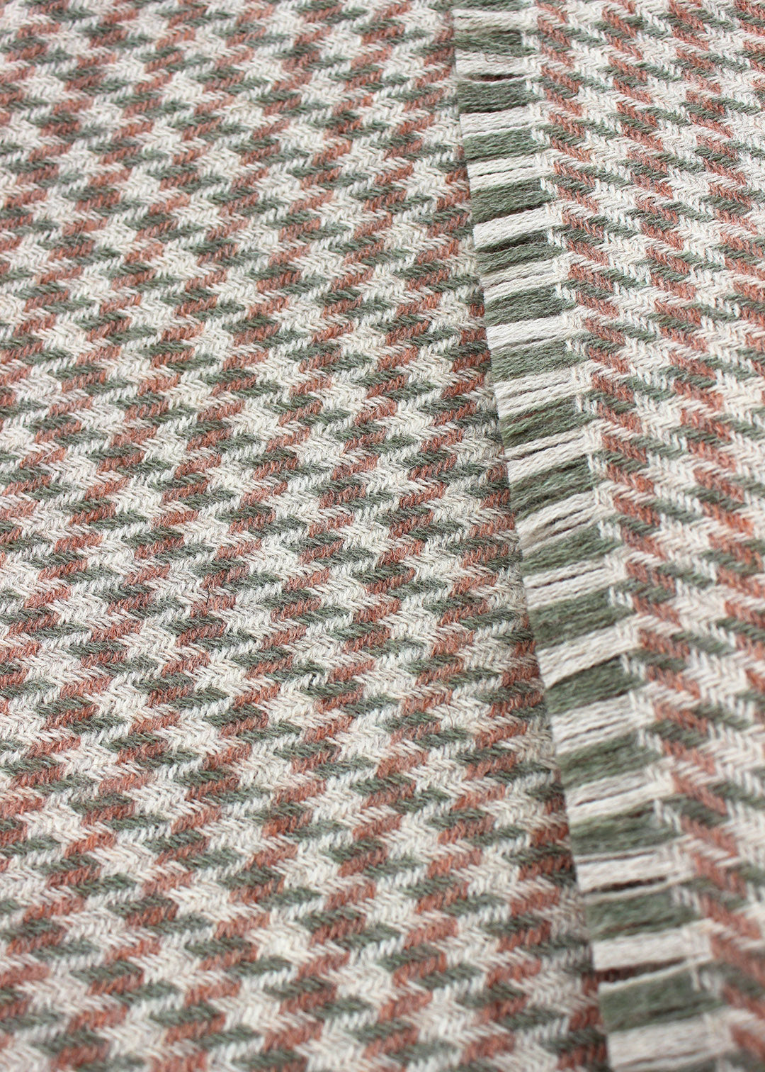 Houndstooth blanket woven in 100% British Wool, a blend of fibres from the Blue Faced Leicester sheep and Masham sheep