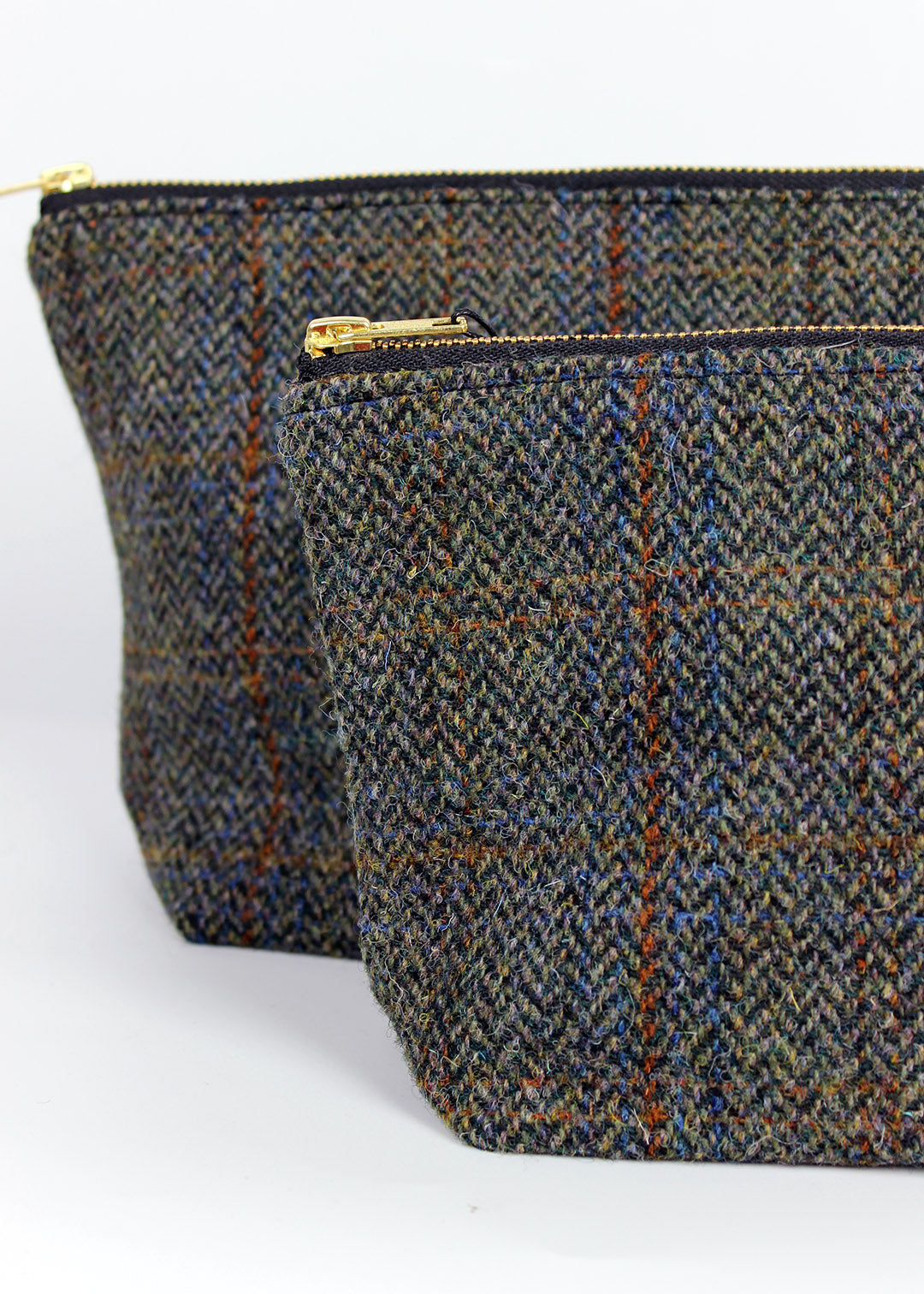 useful multi purpose bag made in store using a beautiful brown herringbone Harris Tweed with rust and blue overcheck