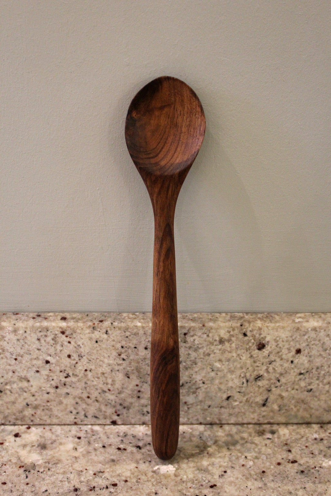Porridge spoon made from walnut. Scottish Textiles Showcase.