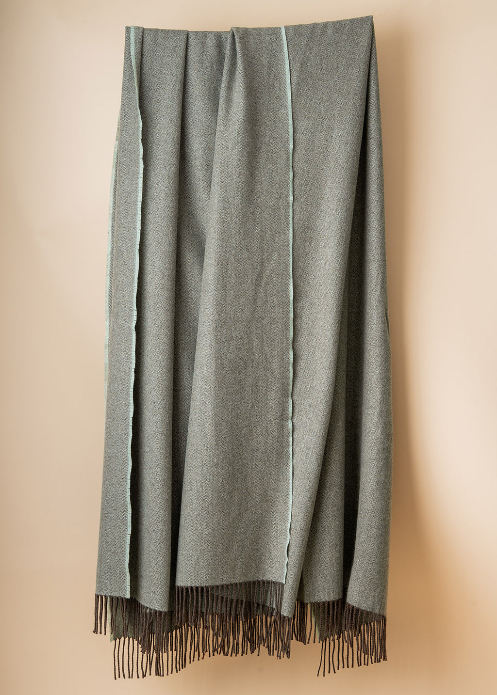 Eggshell cashmere chevron throw.