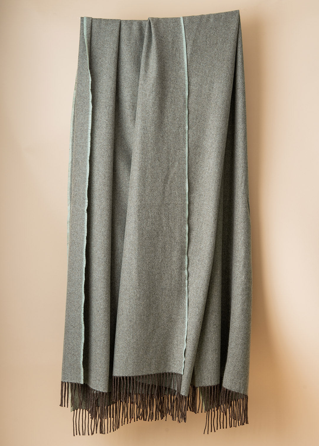 Eggshell cashmere chevron throw.